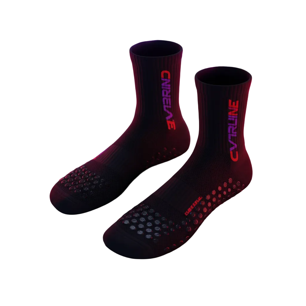 OVERLINE Apex Grip Socks with rubber pedal grip sole and purple red neon branding on dark surface